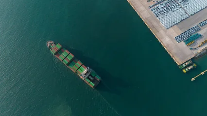  Aerial view from a container drone. Container ships in export-import and logistics business Transporting goods to large ports Worldwide shipping and logistics business International business abroad © eakarat