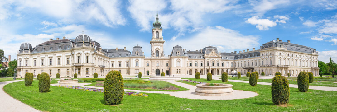 Keszthely, Hungary - May 11, 2026: Festetics kastely, view of the courtyard of the baroque palace from the walking alley in the palace park, sunny summer day.