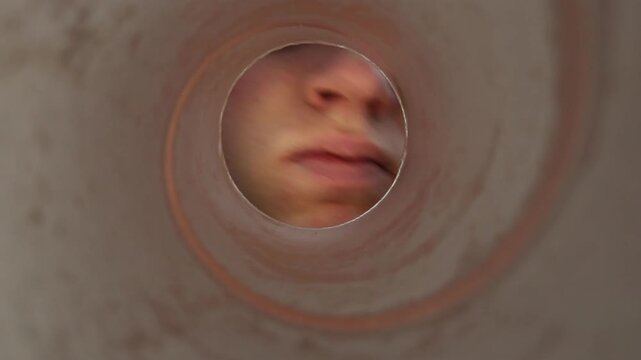 Person eagerly reaches through a cardboard tube trying to grab potato chips from a first person perspective showing strong craving playful behavior and snack temptation