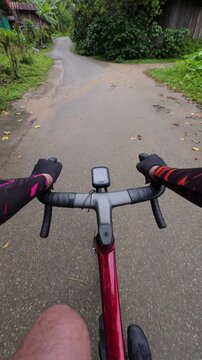 Experience the thrill of cycling through a picturesque rural landscape, capturing the essence of adventure and nature.