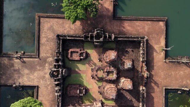 Aerial drone view of the 10th-century Prasat Muang Tam Khmer temple ruins in Thailand, captured empty during a serene morning sunrise