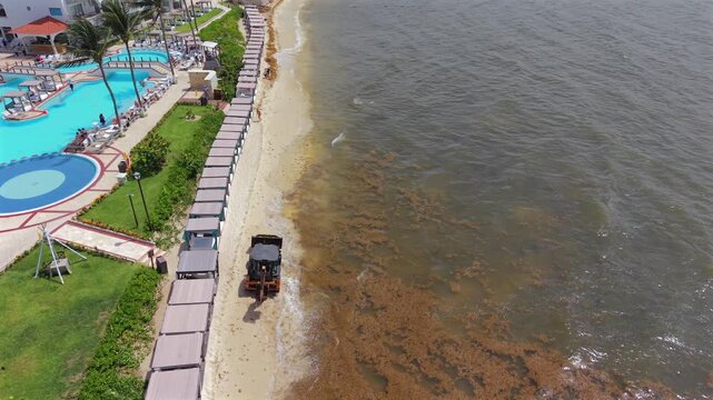 Back hoe along the beach outside a resort in Playa Del Carmen