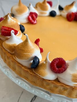 Gourmet Fruit Cake Decorated with Torched Meringue and Summer Berries