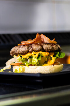 Gourmet bacon cheeseburger on a bun with fresh lettuce and special sauce