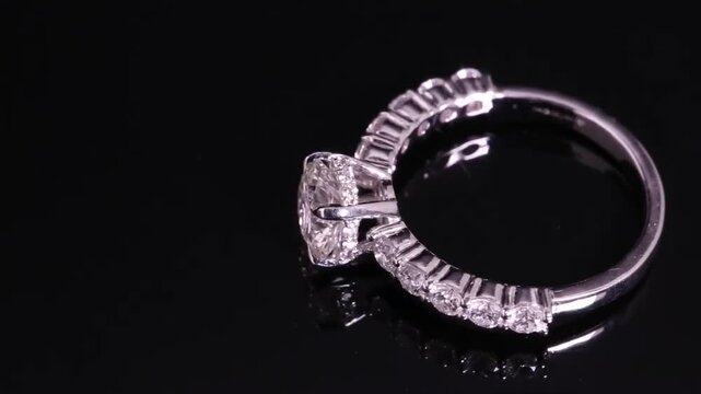 Elegant Diamond Ring on Black Background Sparkling Jewelry.