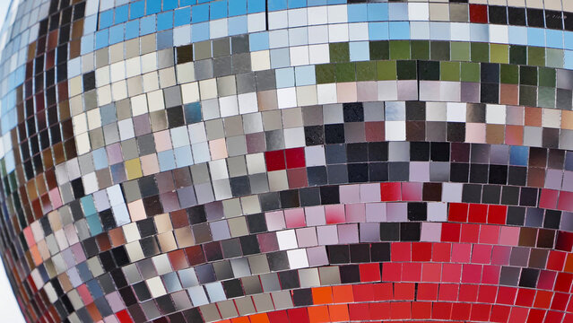 Disco ball reflecting colorful lights creating festive atmosphere