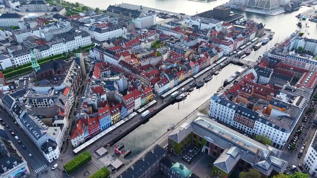 Drone shot facing Nyhavn canal and colorful buildings, Copenhagen, Denmark