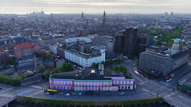 Flight over Palads Teatret building and cityscape, Copenhagen, Denmark