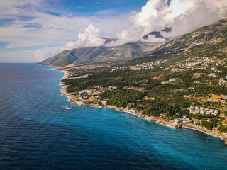 Obraz premium 23 November 2021 Editorial: Aerial view of coastal landscape, turquoise sea, mountains, and residential buildings.