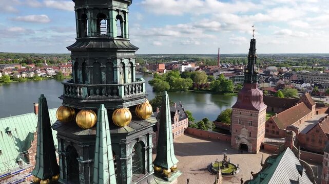 Flight over Frederiksborg Castle towers and courtyard, Hillerod, Denmark