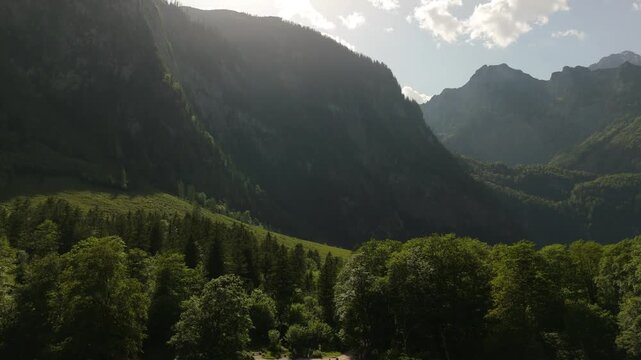 Backlit Mountain Valley Aerial Push In Berchtesgaden Germany