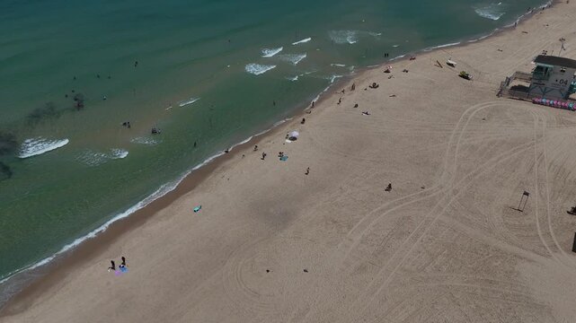 4K Slow Motion Drone Flight from HaKeshet Beach to the Mediterranean Sea, Ashdod, Israel, Swimmers and Lifeguard Tower