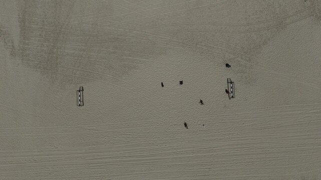 4K Slow Motion Top Down Drone Over Beach Soccer Game on Sandy Shore, HaKeshet Beach Ashdod Israel, Coastal Sports Scene