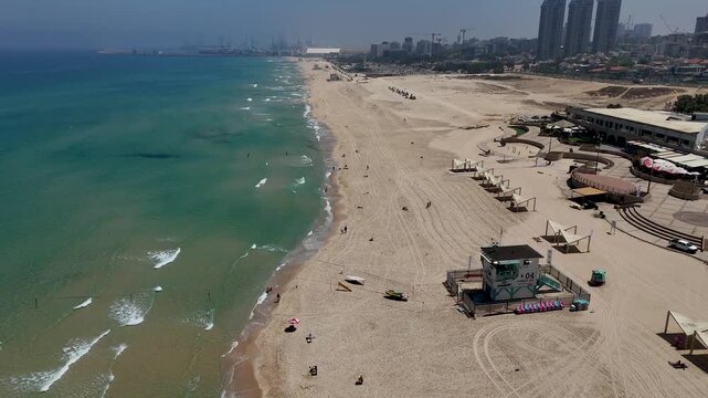 4K Slow Motion Drone Flight North Along Ashdod Coastline, Israel, Reverse Coastal Route with Sea and City Views, HaKeshet Beach