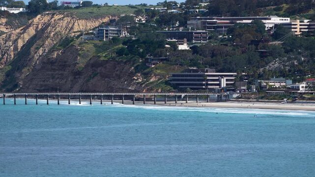Telephoto aerial of coastline landscape of La Jolla Beach and Scripps Pier in San Diego