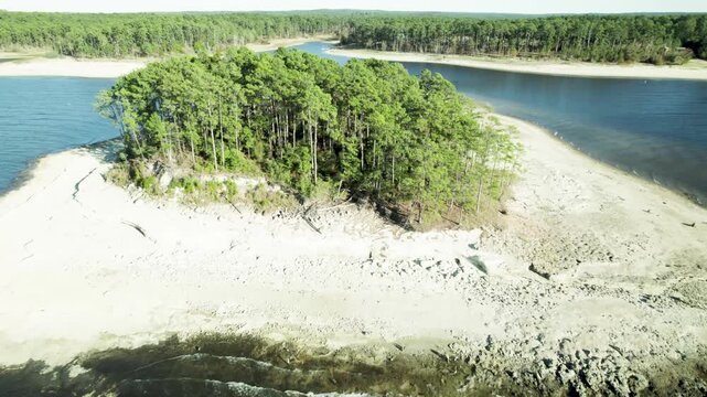 Aerial video of a small island on Sam Rayburn Reservoir near Twin Dikes Park in Texas