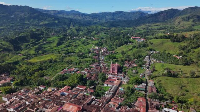 Aerial view of Jerico town surrounded by lush green hills and distant mountains
