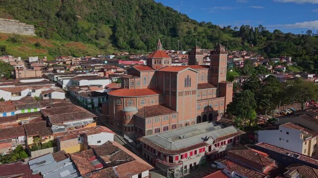 Aerial view of Jerico town center with colorful buildings and large church, Colombia