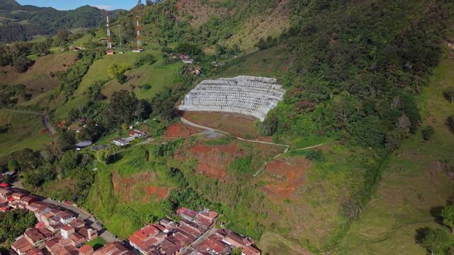 Aerial view of hillside terraces and rooftops on the edge of Jerico, Colombia, sunny day