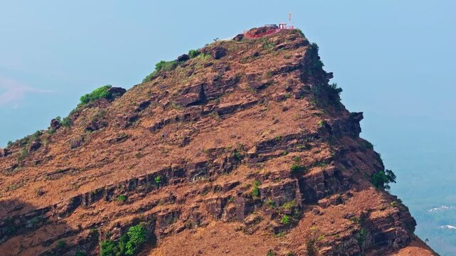 Rocky Mountain Peak and Cliff Edge Aerial View in Baba Budangiri, at Chikkamagaluru, Karnataka, india. day time, semi orbit shot, drone shot, 4k.