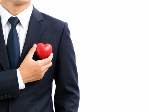 Businessman Holding Red Heart Over His Chest