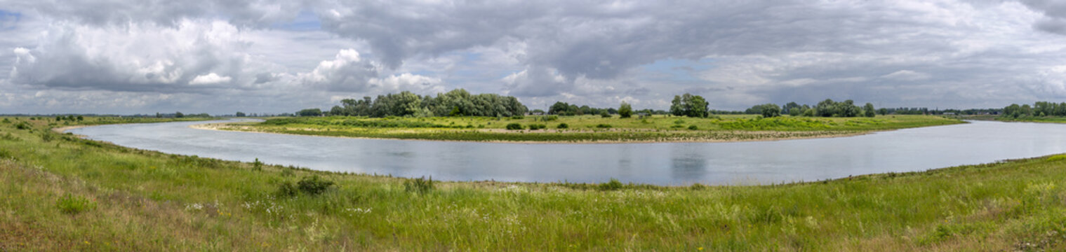 Panoramic view on a bend of the River Meuse in the Maas valley river park on the Netherlands Belgium border, designed for water storage and nature restoration