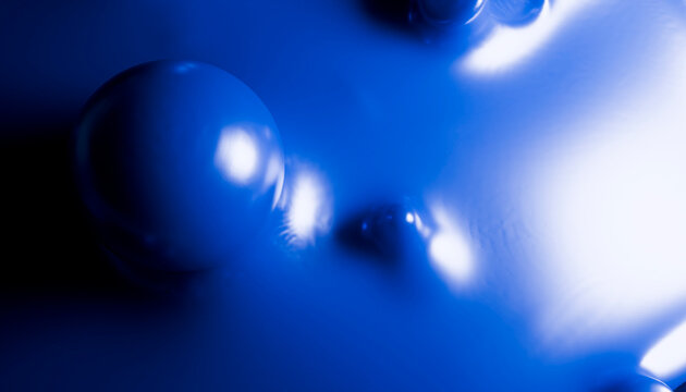 Abstract blue shapes with smooth, reflective surfaces and soft lighting.