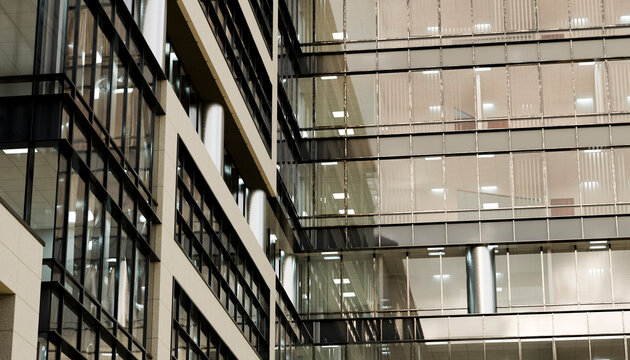 Modern glass and steel office building facade with geometric patterns and reflections. Illustration, rendering