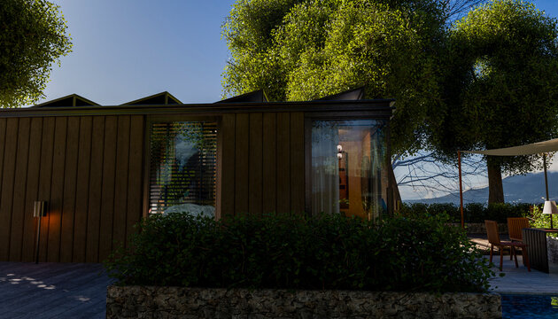 Modern wooden cabin surrounded by lush trees under a clear blue sky.