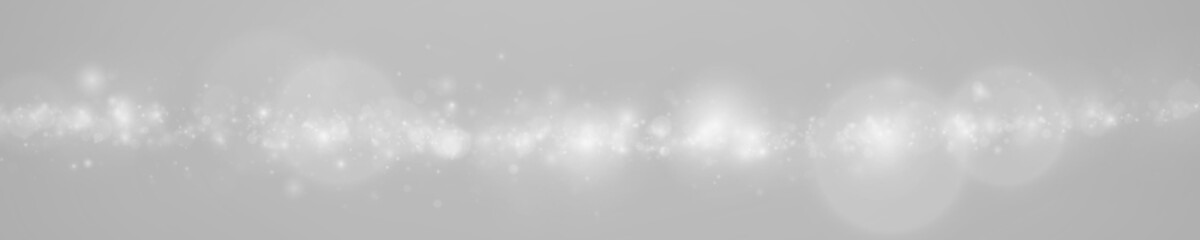 White glitter particles PNG drift through elegant blur background. Golden spark reflections enhance luxury atmosphere. Ideal for premium festive visuals. © Extrastock