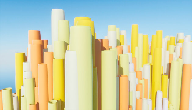 Colorful abstract landscape of tall cylindrical shapes against a clear blue sky.