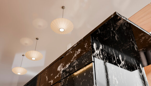 Modern kitchen ceiling with stylish hanging pendant lights and dark marble island counter.