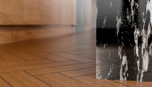 Close-up of a corner in a modern room with wooden floors and a decorative water feature.