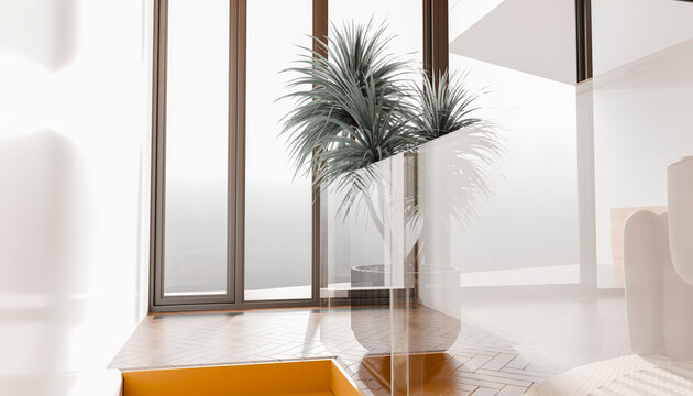 Bright modern interior with large windows and a potted plant near a staircase.