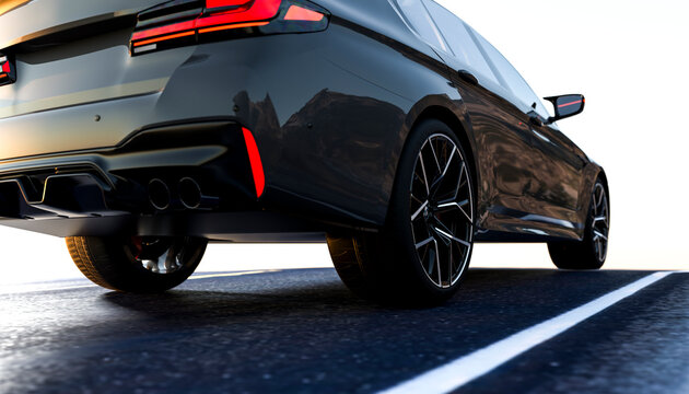 Sleek black sports car with tinted windows on a sunlit road, showcasing modern design.