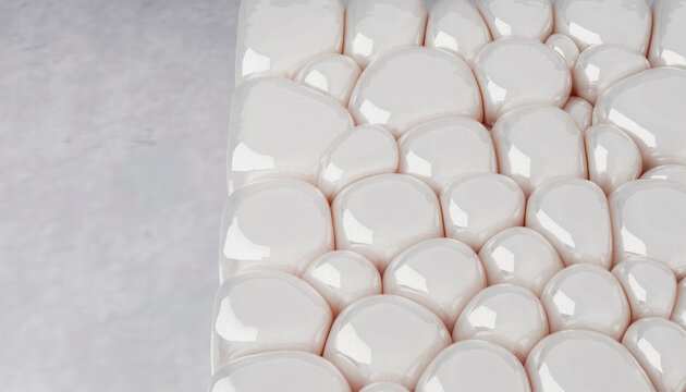 White glossy stones form an abstract pattern on a smooth surface.
