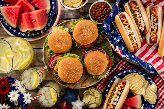 Delicious American 4th of July barbecue picnic feast on a rustic wooden table