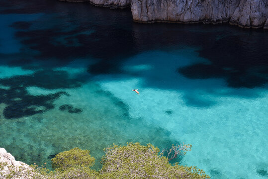 Woman Swimming in the Crystal Clear French Riviera Waters of Calanque d&rsquo;En-Vau During Summer in France