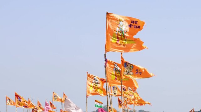 Hindu devotional flags displaying Lord Rama symbols during spiritual gathering and celebration
