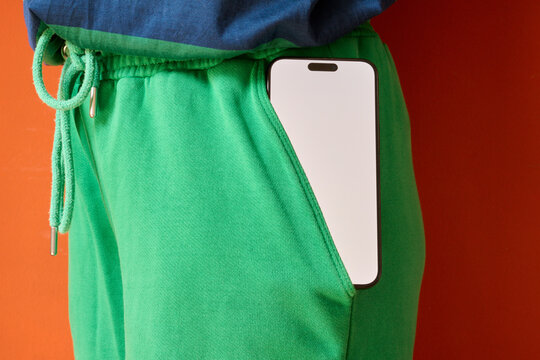 Phone in green pants pocket