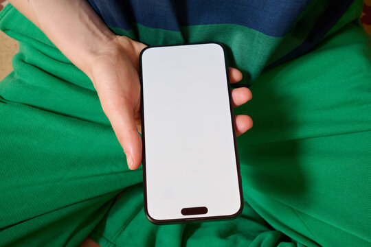 Hand holding blank phone screen