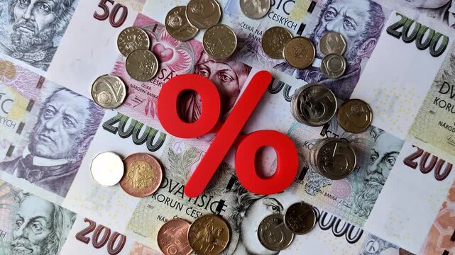 The percentage sign on cash as a concept for inflation, deposits, or tax liabilities. The percentage sign as a financial background for your design