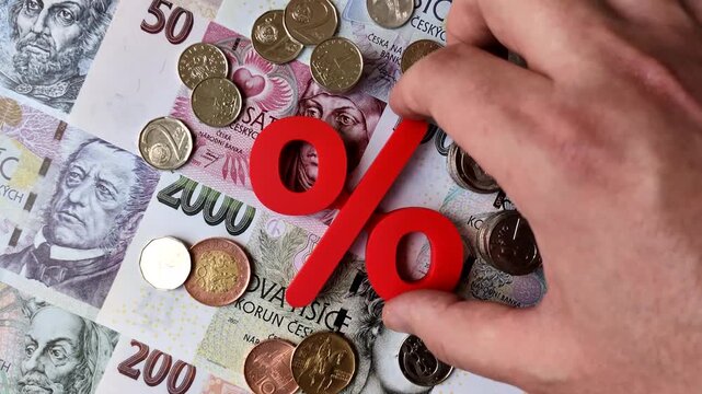 The percentage sign on cash as a concept for inflation, deposits, or tax liabilities. The percentage sign as a financial background for your design