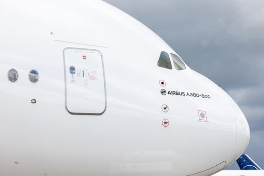 Berlin, Germany - June 14 2026. Scenic side view Airbus A380-800 cockpit windows massive fuselage cloudy sky. Flagship commercial airliner global aerospace engineering long haul passenger transport