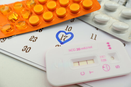 Birth control pills for women and pregnancy test, conception date on the calendar, due date, ovulation day, fetus, pregnancy, birth control and fertility increase.