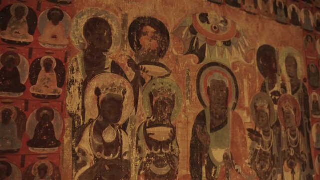 The mural art of the Mogao Grottoes in Dunhuang, China: Ancient Eastern art. Ancient Chinese murals, Mogao Grottoes in Dunhuang, Gansu Province, Buddhist statues, painted sculptures, and mural art.