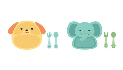 Fototapeta premium Cute children baby plates in the shapes of a yellow dog and a blue elephant with matching forks and spoons on white.