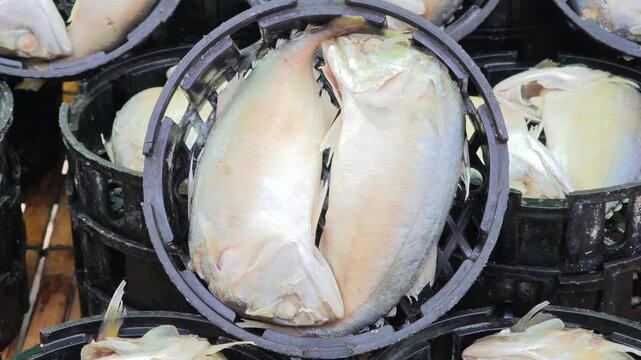 Mackerel in a Black Basket Sold at the Market