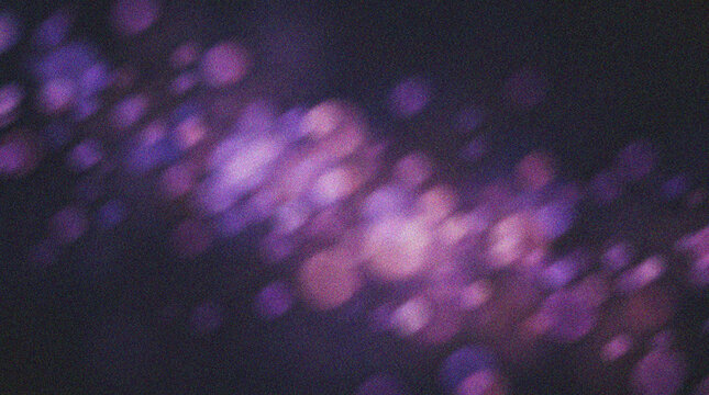 Purple Bokeh Light Background with Soft Glowing Particles