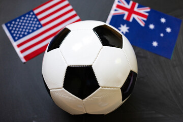 Fototapeta premium usa and Australia flags behind soccer ball
